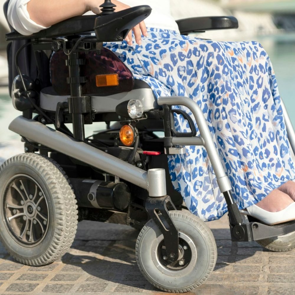 Close-up of an unrecognizable woman in a wheelchair